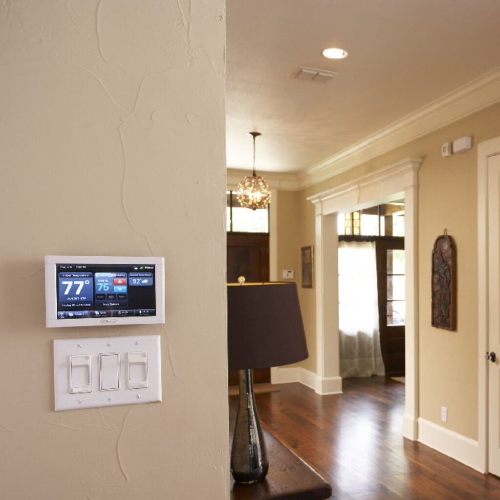 a smart thermostat system installed to the wall of a San Antonio home